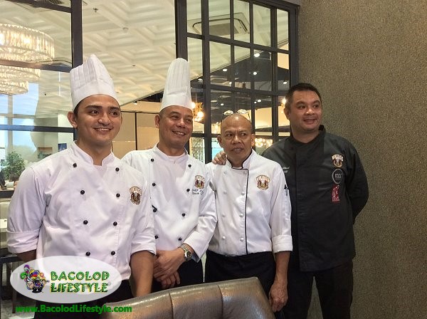 Chef Anton Abad rightmost and his team behind the Thanksgiving buffet at Vikings Bacolod